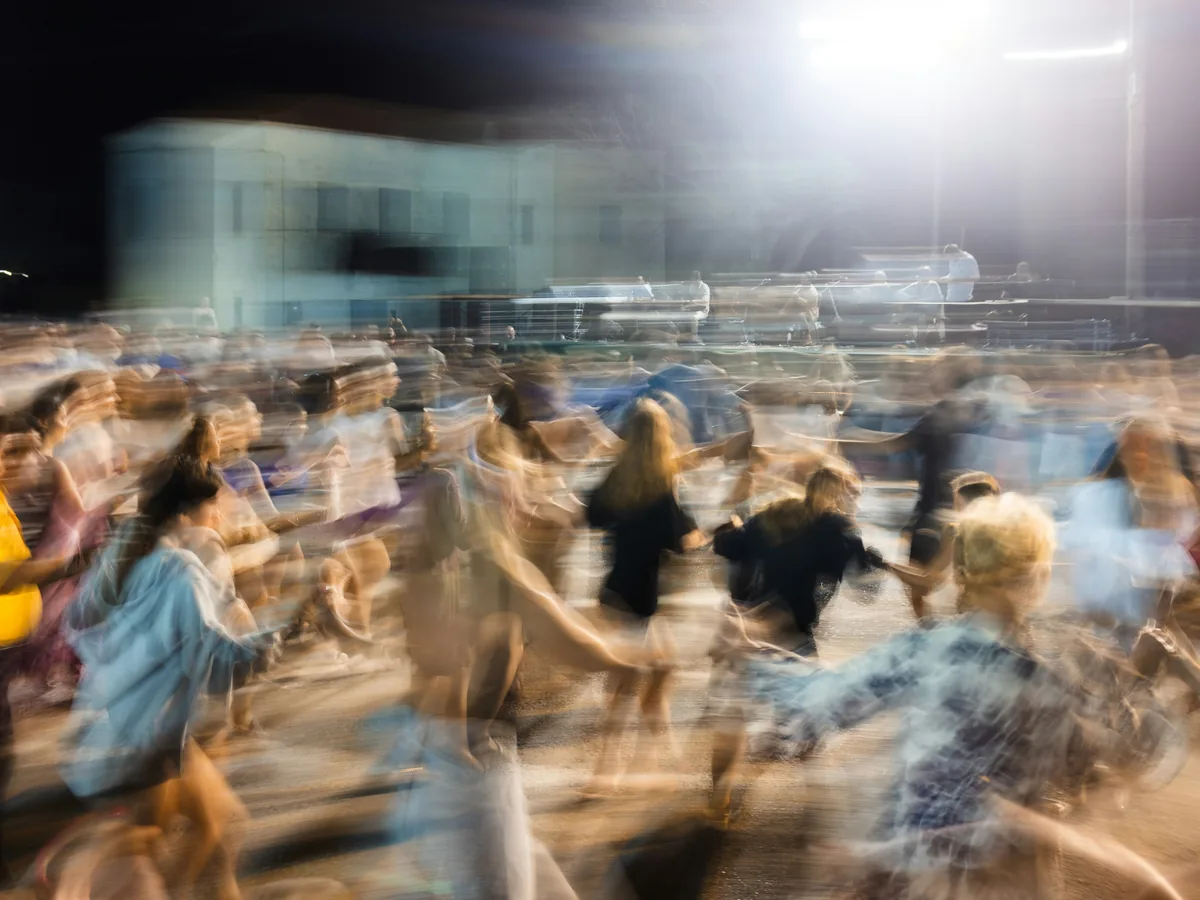 Dancers moving through a traditional Greek circle dance